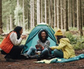 Girls camping in the woods