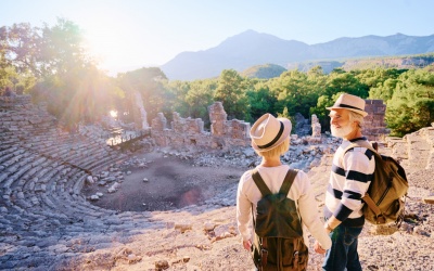Senior family couple enjoying view together on ancient amphitheatre.