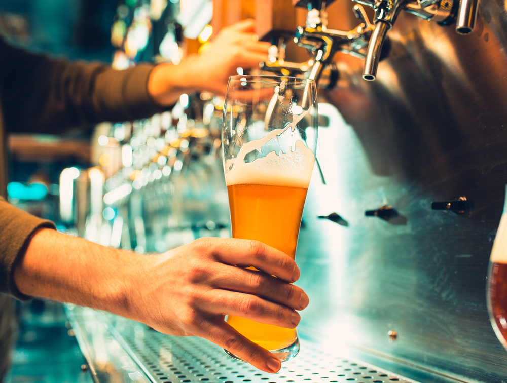 pouring a beer from tap