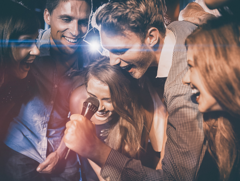 friends singing karaoke 