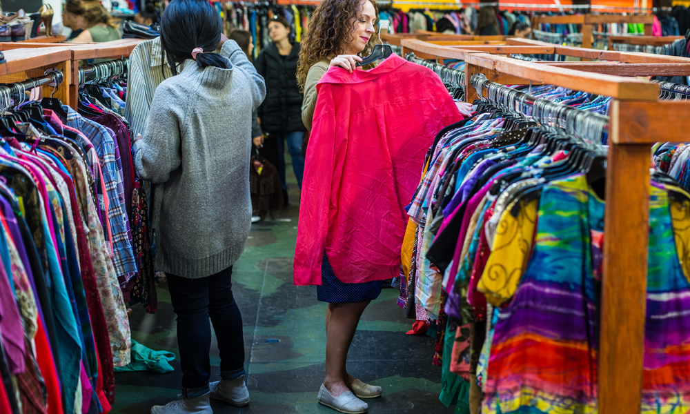 Women browsing through vintage clothing