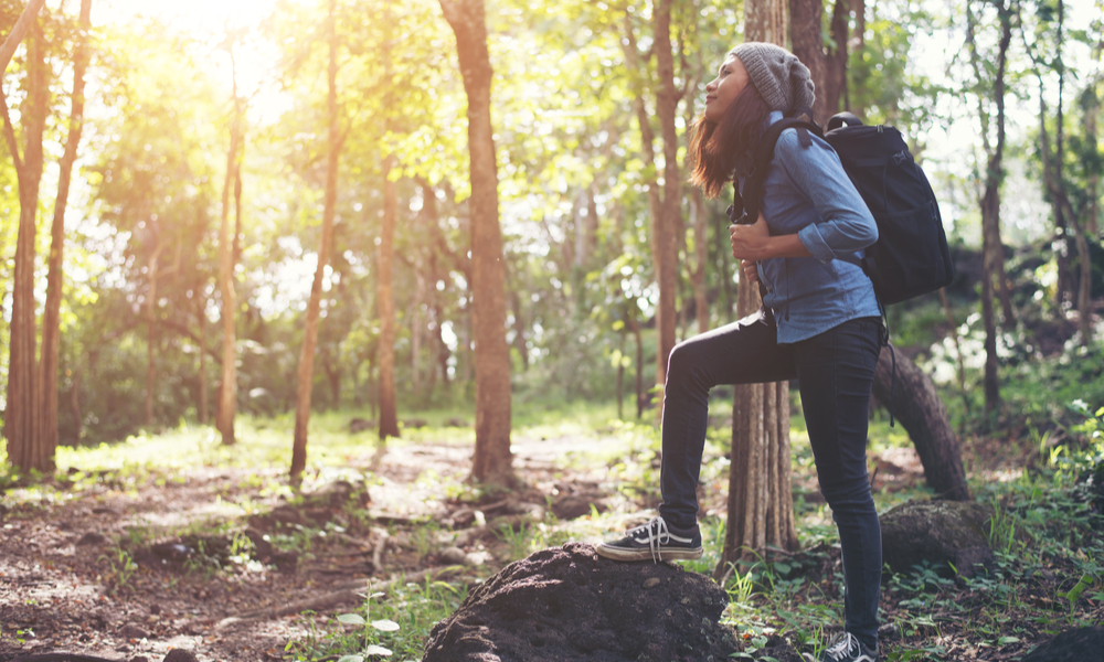 Hipster young woman hiking holiday, wild adventure.